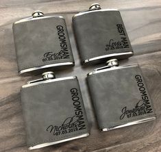 four groomsmen flasks with their names engraved on them