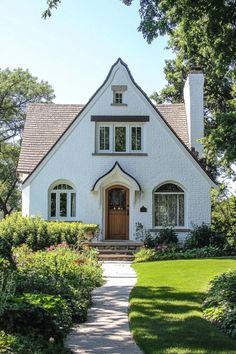 a white house with a brown door and windows