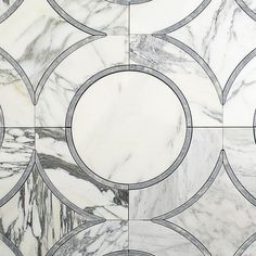 an artistic marble tile design with circles in the center