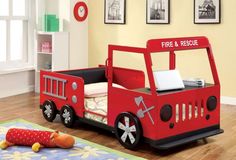 a child's fire truck bed is shown in this room