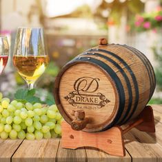 a wooden barrel and some wine glasses on a table