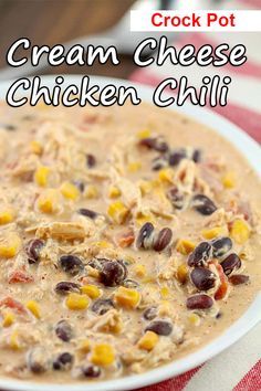 crock pot cream cheese chicken chili recipe on a white plate with red and white checkered table cloth