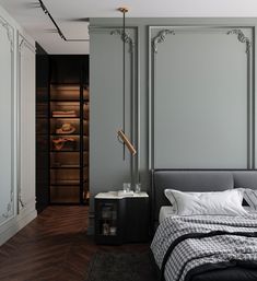 a bedroom with gray walls and wooden floors