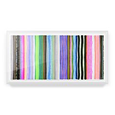 an art piece with multicolored stripes on the wall and white frame above it