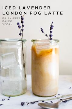 two mason jars filled with iced lavender london fog latte, one is empty and the other has ice in it