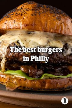 the best burgers in phily are made with beef and cheese on a sesame seed bun