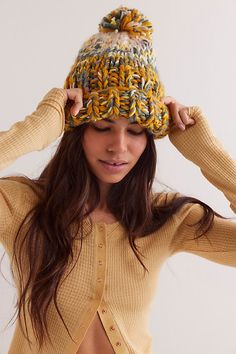 Essential for cold-weather accessorizing, this beanie features a chunky knit fabrication with a folded cuff and oversized pom. **Features:** Chunky knit fabrication, folded cuff, oversized pom detail, slouchy beanie style **Why We ❤ It:** This beanie adds a cozy touch to every look. | Tide Knit Pom Beanie by Free People in Gold Beanie Style, Knitted Beanie, Slouchy Beanie, Pom Beanie, Chunky Knit, Hat Fashion, Boho Outfits, Cold Weather, Color Coding