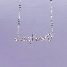 "💜Show your love for BTS with this stylish \"Jungkook\" necklace! 💜Made of high-quality 18 gauge copper wire.  The chain is plated brass. The necklace features \"Jungkook\" in bold, eye-catching letters. It's the perfect accessory for any fan of BTS, and makes a great gift for any occasion. 💜 Whether you're wearing it to a concert or just showing off your love for BTS, this necklace is sure to make a statement.  💜Order yours today and let everyone know you're a proud member of the BTS ARMY! 💜Enjoy free domestic shipping! Starting 12/28/22 all items will ship out next day.  If we are unable to ship next day for any reason, we will let you know immediately.  💜Please note that copper may tarnish over time, but you can keep the color intact by storing the necklace in a dry place and avoi Jungkook Necklace, Bts Ring, Bts Necklace, Bts Jewelry, Bts Keychain, Bts Gifts, Kpop Jewelry, Bts Earrings, Bts Bracelet