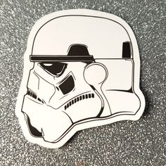 a star wars helmet sticker on the ground