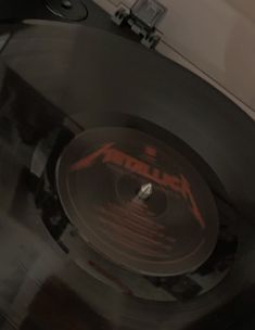 an old record player with the word metallic on it's side is spinning around