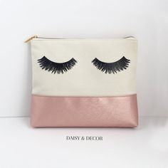 Our hand drawn eyelashes now come on cosmetic bags! This makeup bag is the best addition to your collection! It is big enough for all of your makeup pallets and fits so much makeup, jewelry, and the list goes on!Eyelashes Printed on One SideMeasurements: 9.75 x 8 x 1.5"Material: Cotton Canvas and faux leatherlined inside. Lining is cream color. Makeup and jewelry shown not included©Daisy and Decor. Rose Makeup, Makeup Pallets, Large Clutch, Godmother Gifts, Pouch Organizer, Makeup Eyelashes, Jewelry Show, Best Friend Gift, Makeup Pouch