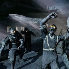 the zombies are walking around with their hands in the air and glowing yellow eyes on their faces