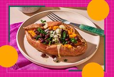 a white plate topped with a baked potato covered in beans and vegtables