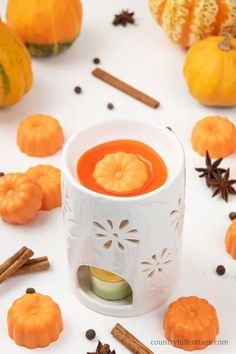 pumpkin spice wax melts in a white cup