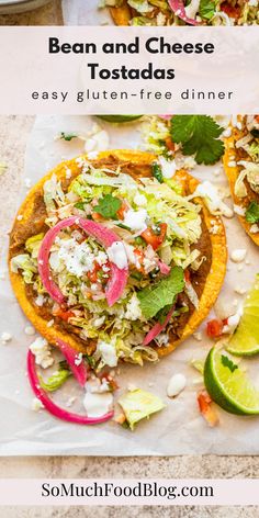 two tacos with shredded cabbage, red onions and cilantro on the side