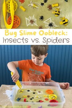 a young boy is playing with insects and spider webs in his play tray, while another child looks on