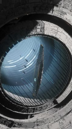 an aerial view of the inside of a building with many circular windows and metal structures