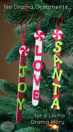 christmas ornament made out of popsicles and candy canes hanging from a tree