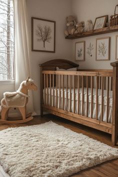 a baby's room with a wooden rocking horse and sheep rug on the floor