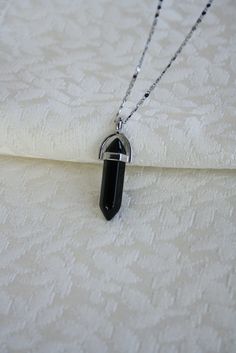 "Dainty Black Onyx Crystal Point Pendant Necklace, Natural Black Healing Crystal Onyx Stone, Black December Birthstone, Real Raw Onyx Pendant *Occasion: Valentines / Party / Anniversary / Wedding / Birthday Gift / Christmas Gift / Thanksgiving / Mothers Day *An exclusive gift jewelry for you and your loved one *Elegant Design: Beautifully aligned with black onyx stone (Stone may vary slightly from selection in picture) *Material: Cupronickel chain, real natural onyx *Color: Black *Guaranteed Sat Black Gem Necklace, Black Onyx Aesthetic, Black Healing, Black Long Necklace, Black Onyx Crystal, Onyx Color, Valentinstag Party, Onyx Colour, Onyx Crystal