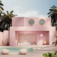 a pink house with three round windows and palm trees in the back ground, next to a swimming pool