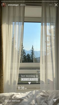 an open window with the words just morning in german on it, and trees outside