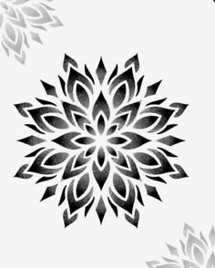 a black and white image of a flower with leaves on it's petals in the center