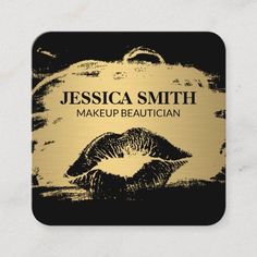 makeup business card with gold lips on black and white background, featuring the logo for cosmetics company