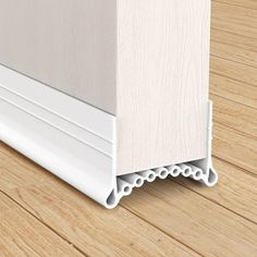 an image of a wooden floor with white trimmings on the bottom and sides