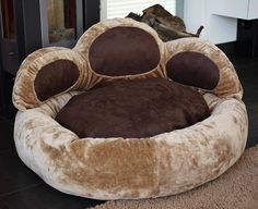 the dog bed is made to look like it's been curled up and ready for its owner