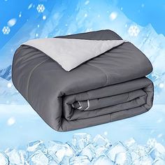 the comforter is on top of an ice - covered mountain with snowflakes