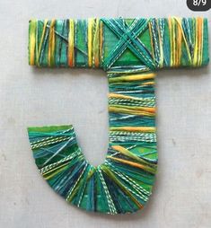 the letter j is made out of yarn