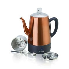 an electric tea kettle with a strainer next to it