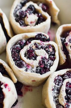 blueberry pastry rolls with powdered sugar on top