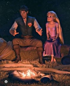 a man and woman sitting next to a campfire