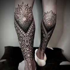 the legs and ankles of a person with tattoos on them, both showing their intricate designs