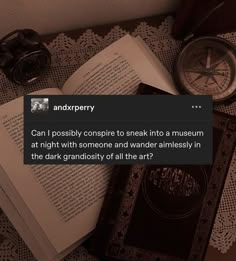 an open book sitting on top of a table next to a pair of glasses and a pocket watch