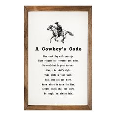 a cowboy's code framed art print on white paper with brown wood frame and black lettering