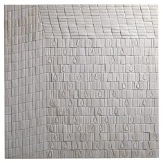 a white tile wall with many drops of water on the bottom and bottom tiles below