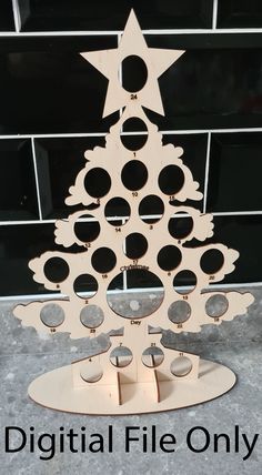 a wooden christmas tree with circles and stars on it