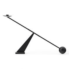 a black table lamp with two lights on it's sides and one light on the other