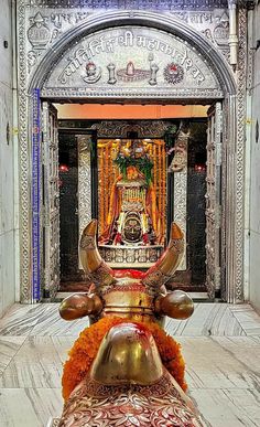 an ornately decorated shrine in the middle of a building