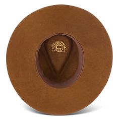 Charlie 1 Horse CWGYPS-403611 Gypsy Acorn Wool Hat Imbued with a wanderer’s soul and made for the open road, the Gypsy in Acorn is a delightful wool hat with a 3 3/4" pinch-front crown and a 3 3/4" floppy downturned brim. The beaded hatband features a classic Native-American-inspired pattern in blues, reds, and golds, with a lone feather tucked in for good measure. An off-center Charlie 1 Horse brand logo on the crown signals the hat’s point of origin. Part of our Wanted Collection, the Gypsy wa Brown Wool Fedora With Flat Brim, Brown Wool Fedora With Curved Brim, Brown Wool Fedora, Vintage Outdoor Hat For Fall, Vintage Hats For Outdoor Fall Use, Vintage Fall Hat For Outdoor, Brown Hats For Outdoor Fall Activities, Rustic Felt Hat With Short Brim For Fall, Vintage Hat Bands For Outdoor Fall Activities