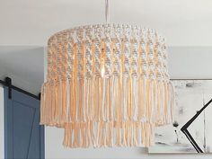 a chandelier hanging from the ceiling in a room