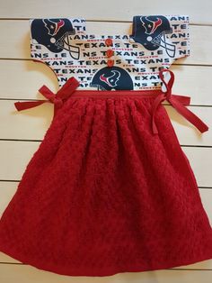 a red dress with a football helmet on it