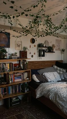 a bed room with a neatly made bed and lots of books on the shelves next to it