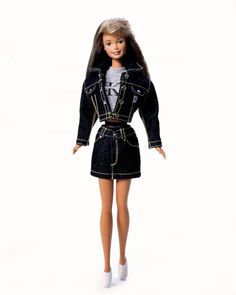 a barbie doll wearing a denim jacket and skirt with white shoes on the bottom, in front of a white background