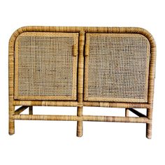 a wicker sideboard with two doors on the front and one door open to show it