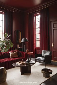 a living room filled with furniture and red walls