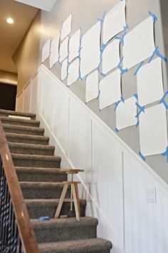 there are several boxes on the wall next to the stair railing and carpeted stairs